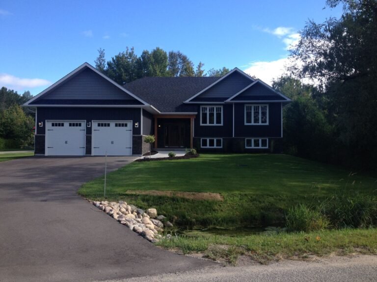 Finished home and driveway with restored landscape