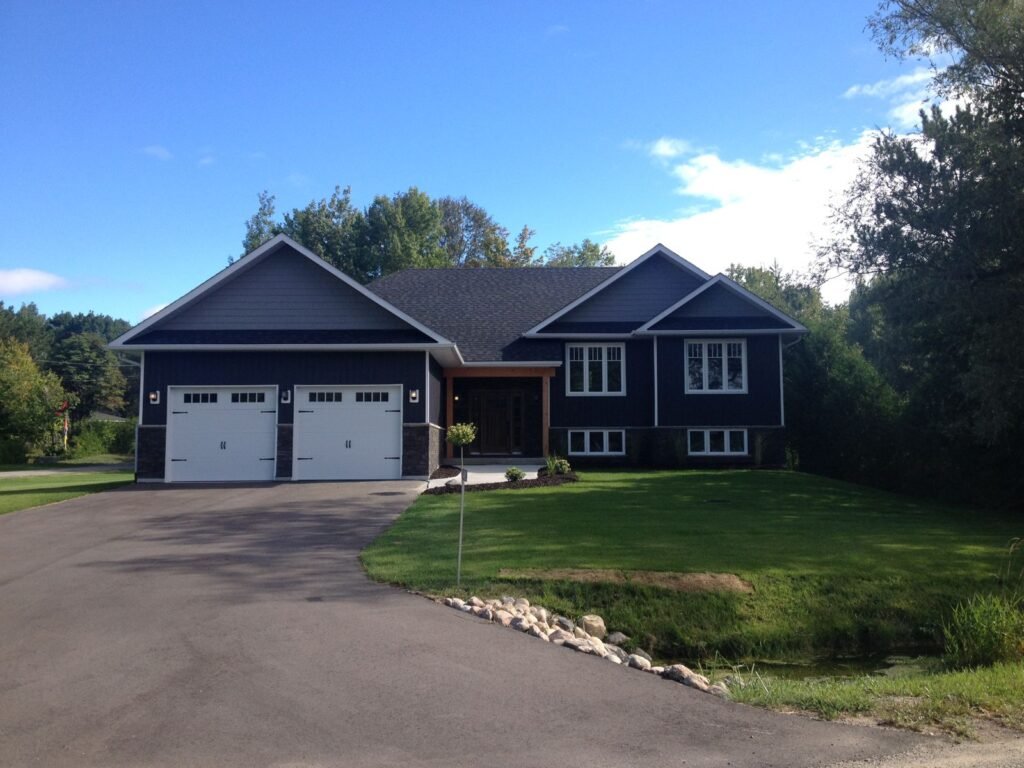 Finished home with paved driveway and final grading